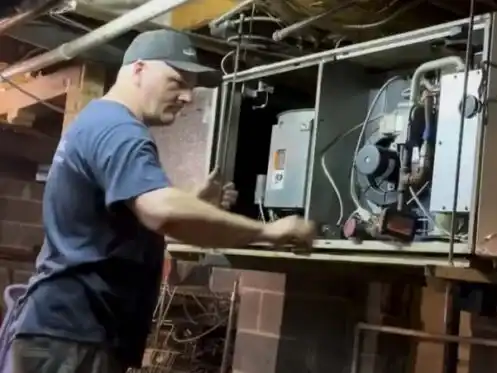 tech working on furnace